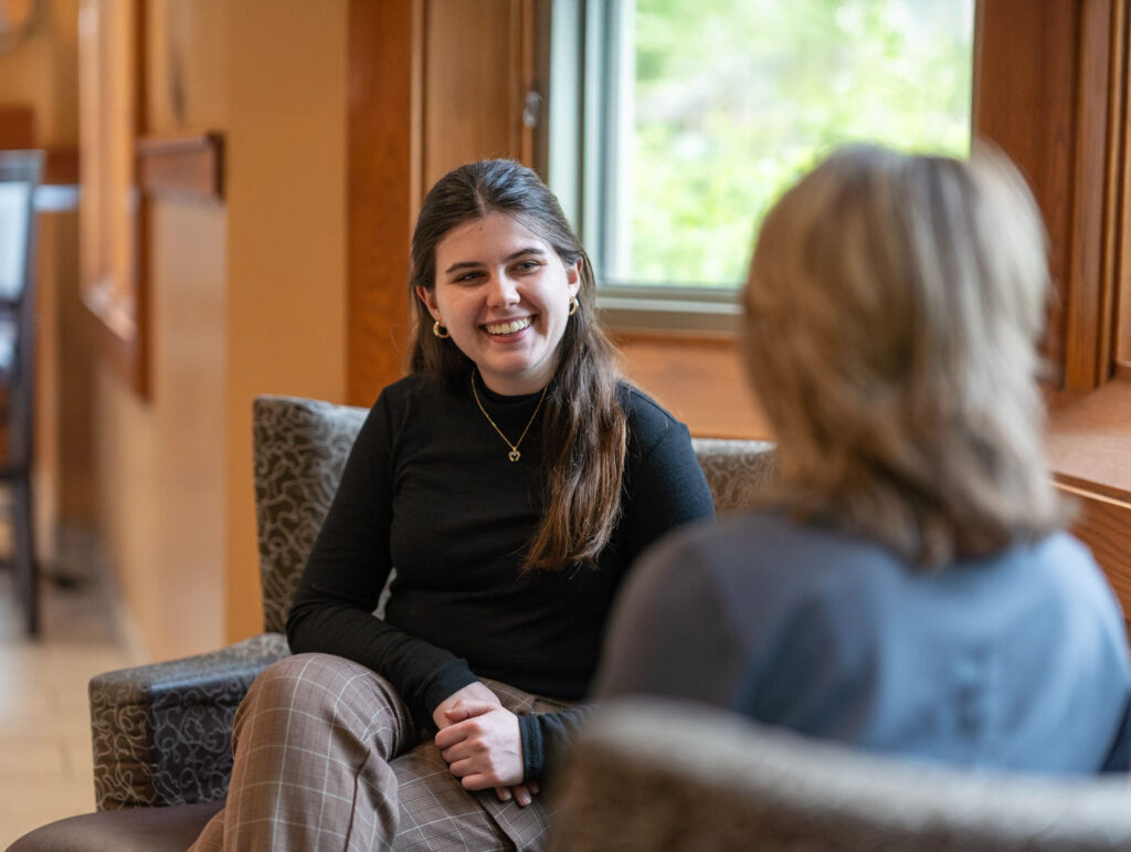 A student sits and talks with a career counselor