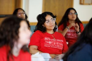 Students sit and focus on listening to a speaker at a retreat aimed to ease the transition to WashU